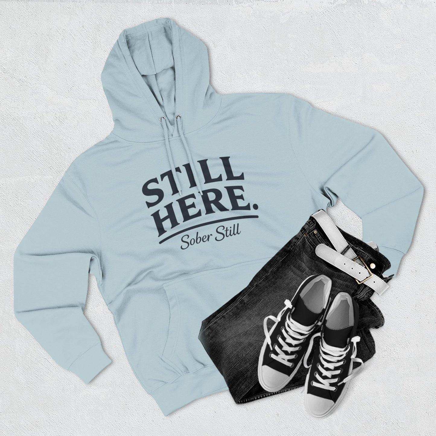 "Still Here." hoodie by Sober Still, size chart graphic