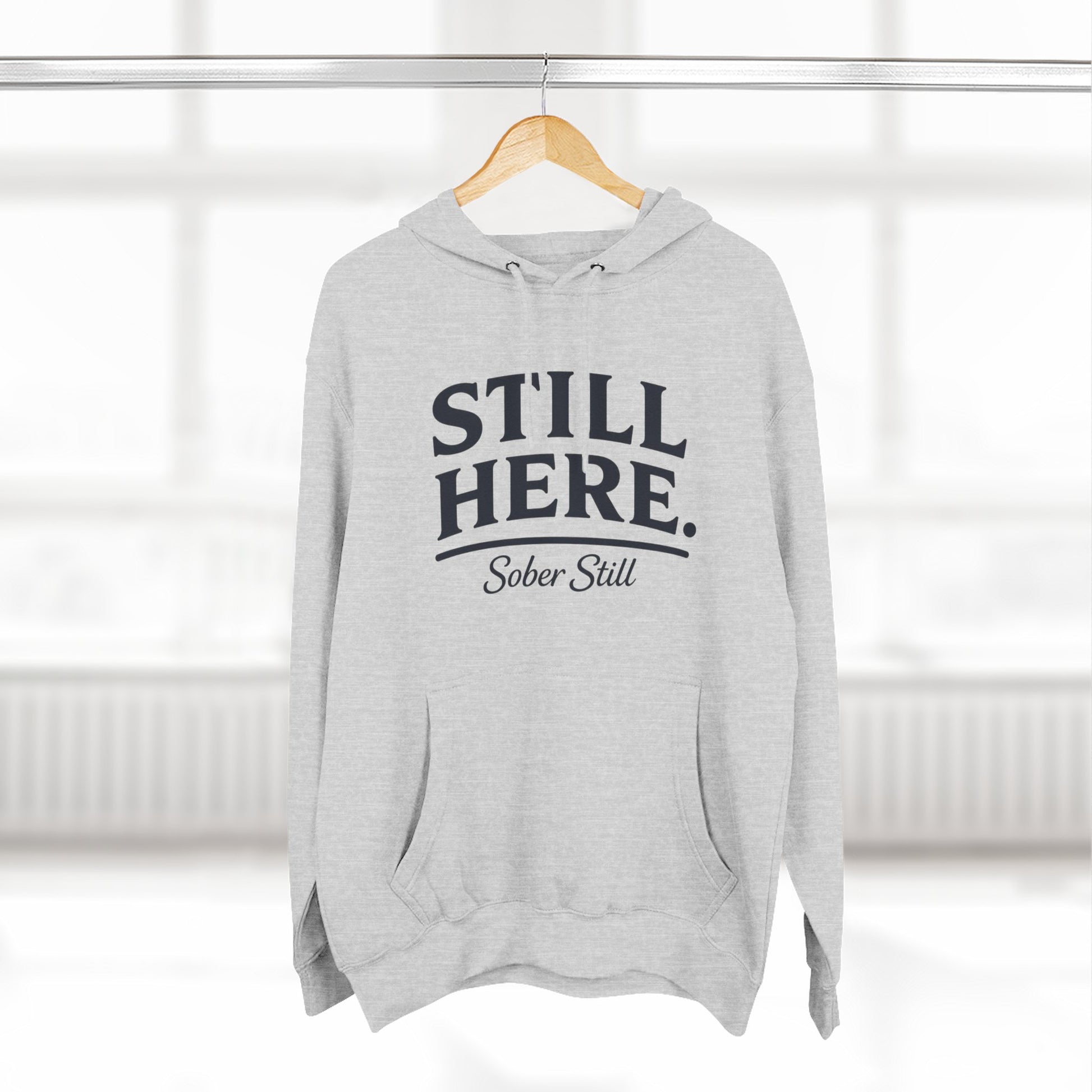 "Still Here." hoodie by Sober Still, front view