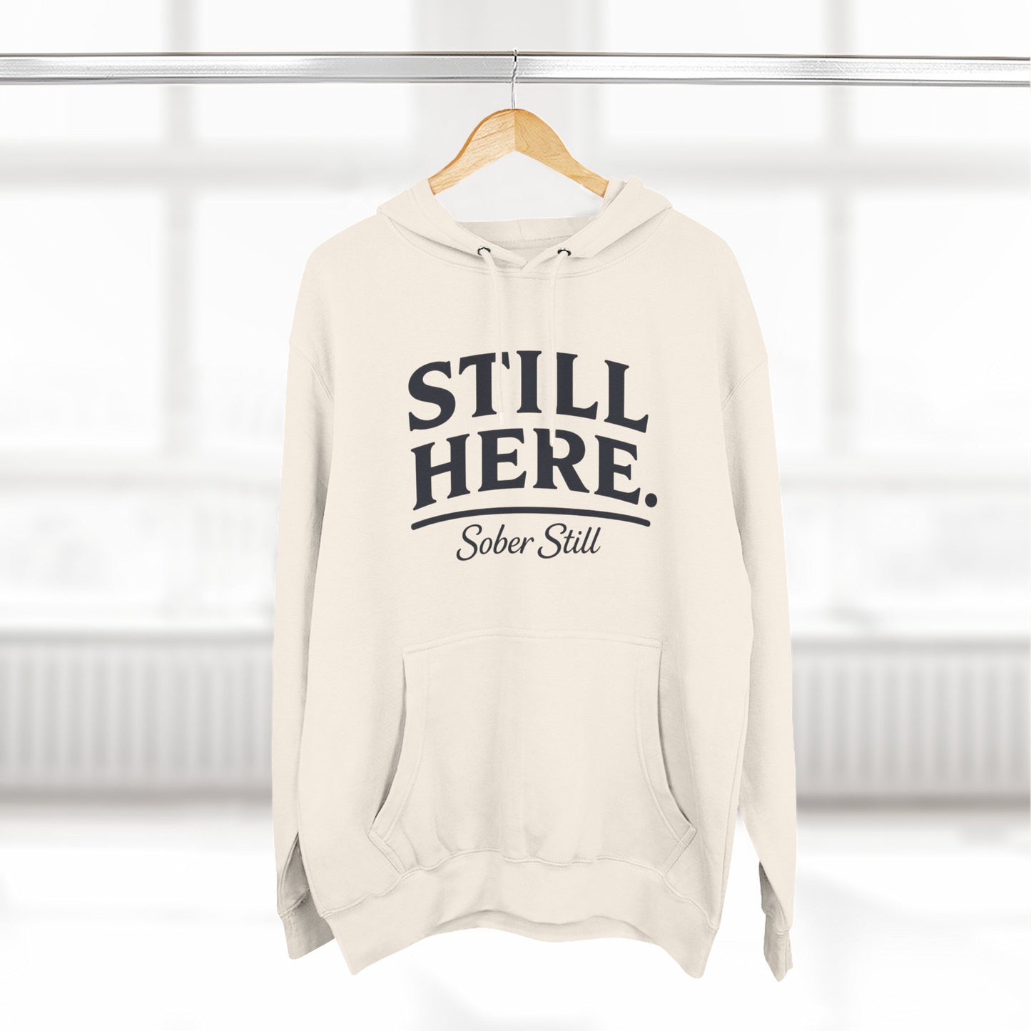 "Still Here." hoodie by Sober Still, worn on model, alternate pose